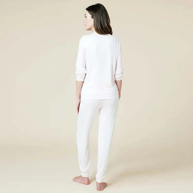 Dream Jersey Crew Neck Lounge Set in soft fabric, featuring long sleeves and jogger pants, worn by a woman standing with back view.