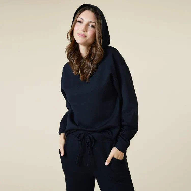 DreamTech Oversize Hoodie Lounge Set in black, featuring a relaxed fit with side pockets and elasticized jogger pants.