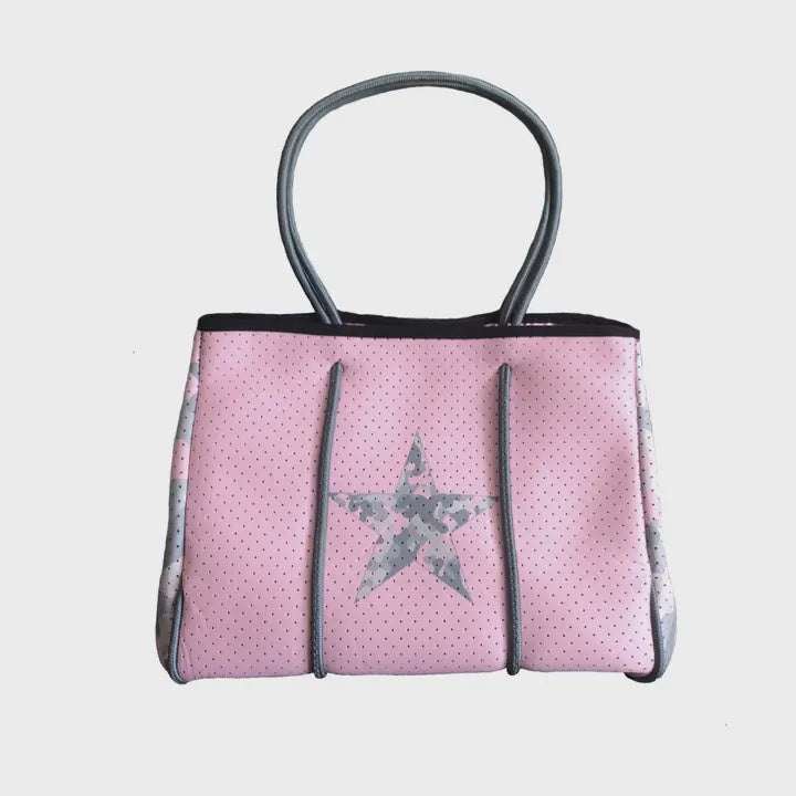 Neoprene tote bag with star design, perforated fabric, and detachable pouch.