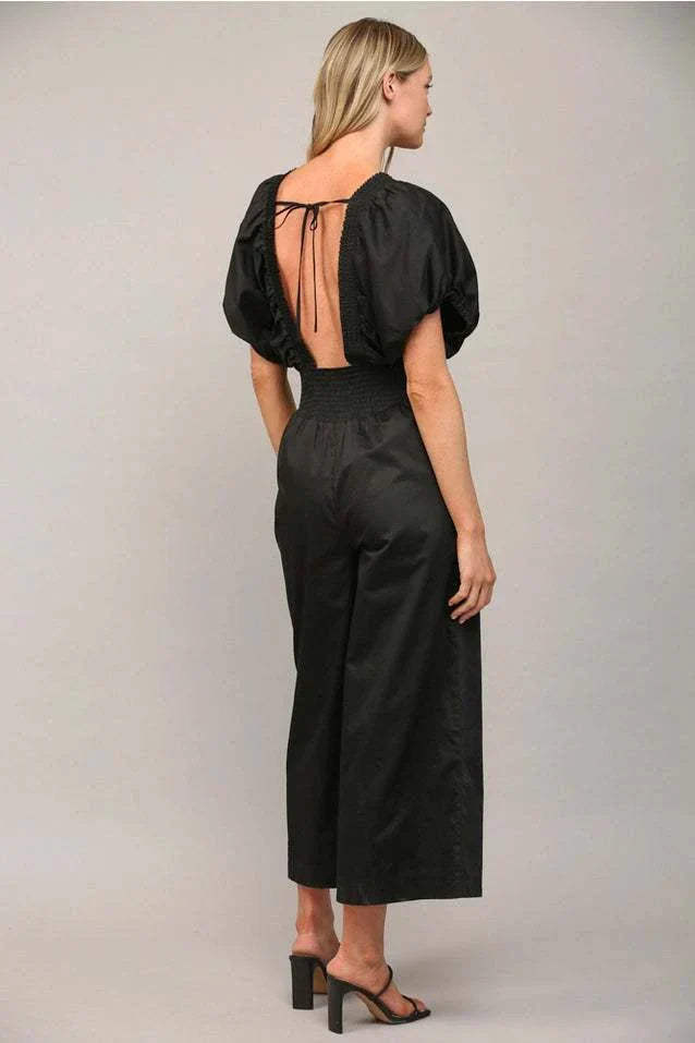 Open Tie Back Jumpsuit with an alluring open back design and adjustable tie, ideal for fashion-forward style and comfort.