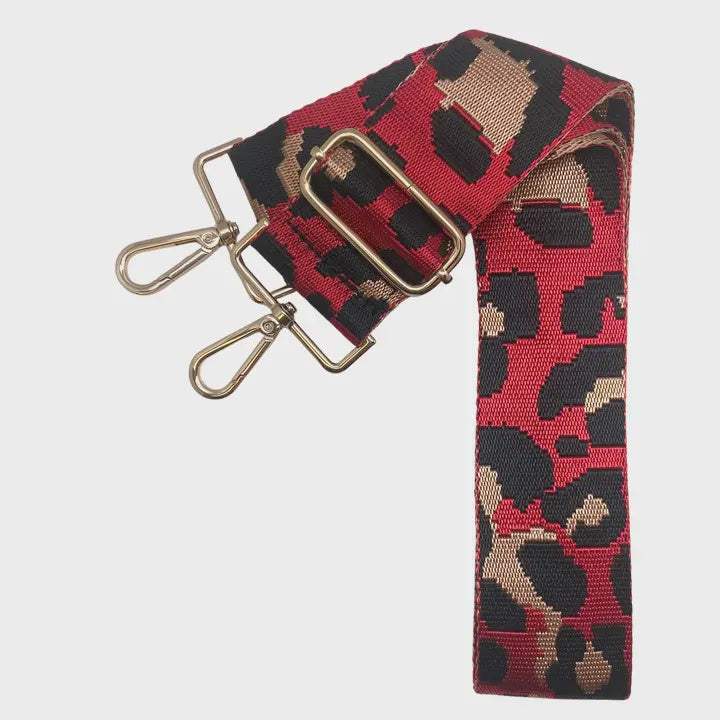 Leopard print bag strap with metal clips, adjustable for versatile styling.