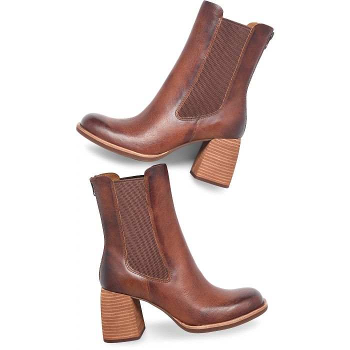 Mid-height Arline Chelsea boots with tapered shaft, flared block heel, and rear zipper in brown leather.